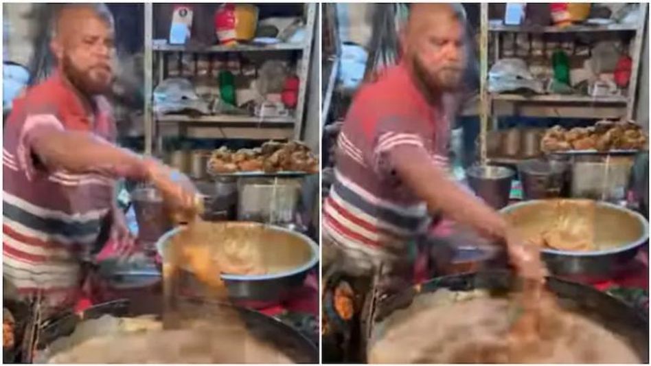 হাতা-খুন্তির বালাই নেই, ফুটন্ত তেলে হাত ডুবিয়েই ভাজছেন মুরগি, দেখুন ভিডিও হাতা-খুন্তির বালাই নেই, ফুটন্ত তেলে হাত ডুবিয়েই ভাজছেন মুরগি, দেখুন ভিডিও