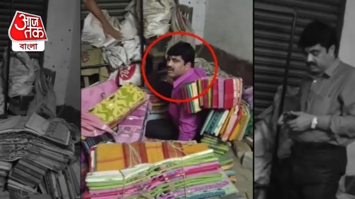 অভিযোগ, পুলিশের হাত এড়াতে কাপড়ের দোকানে শাড়ির স্তূপের নীচে লুকিয়েছিলেন তিনি।