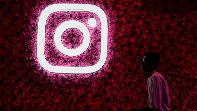 A man walks past a logo of mobile application Instagram, during a conference in Mumbai, India, September 20, 2023. REUTERS/Francis Mascarenhas/ File Photo Instagram logo