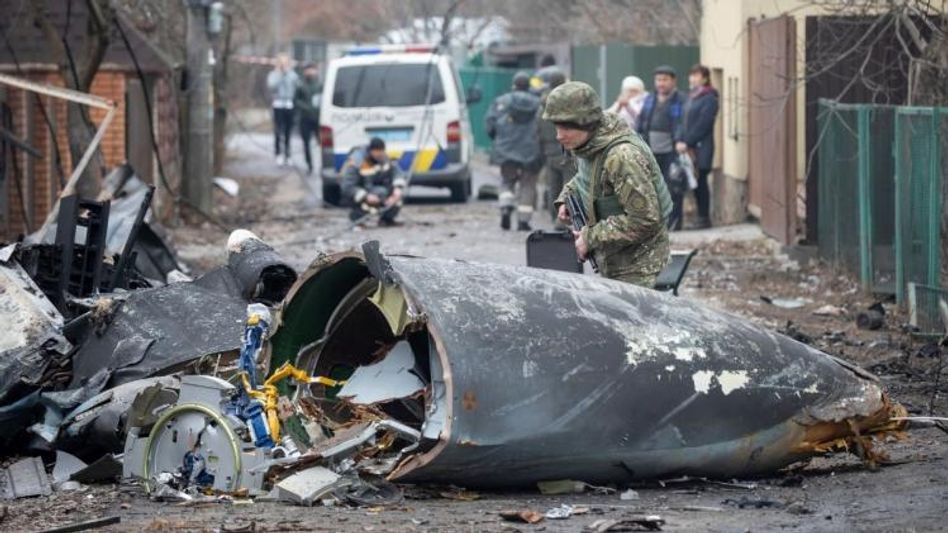 A Ukrainian Army soldier inspects fragments of a downed aircraft in Kyiv A Ukrainian Army soldier inspects fragments of a downed aircraft in Kyiv