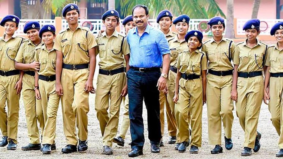 Students Police Cadets with IPS P Vijayan (photo: Facebook) Students Police Cadets with IPS P Vijayan (photo: Facebook)