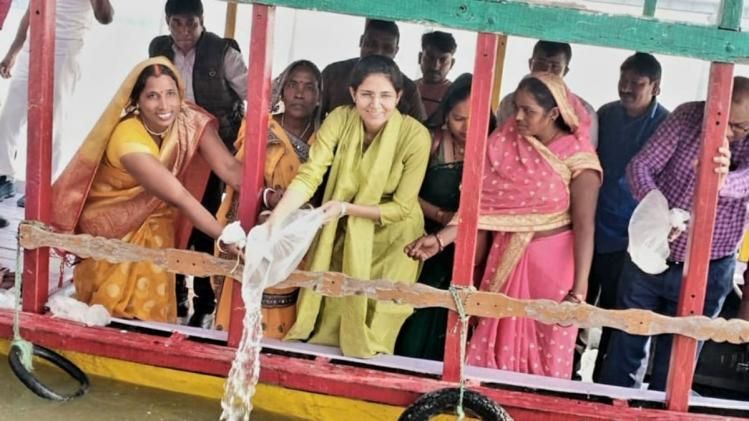 DM Isha Duhan with people released fish seeds in river