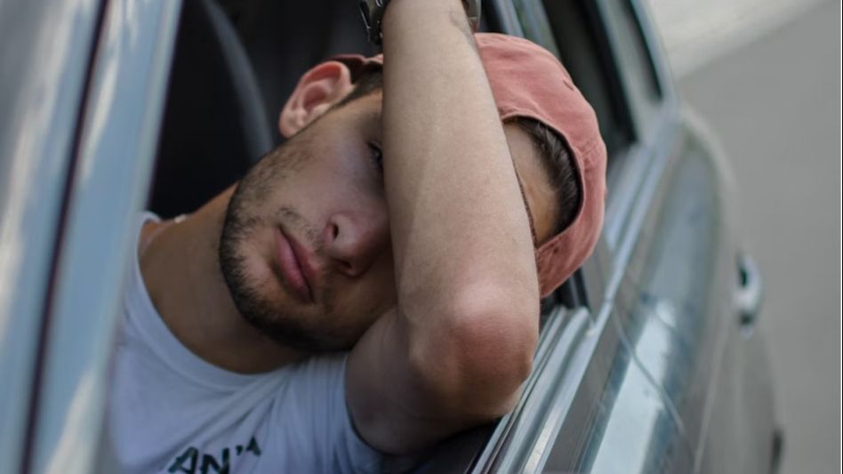 Man sitting in car/Unsplash Man sitting in car/Unsplash