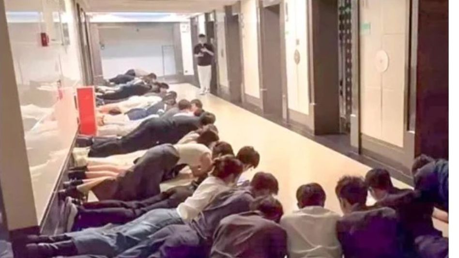 staff lying in a corridor to greet their boss staff lying in a corridor to greet their boss