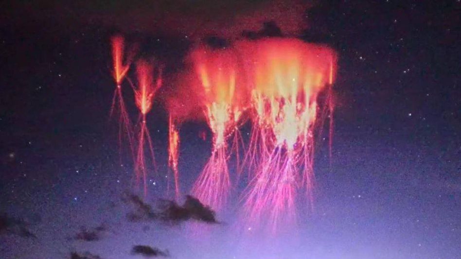 A spectacular display of more than one hundred "red sprite" lightning events was captured above the Himalayas in Tibet. A spectacular display of more than one hundred "red sprite" lightning events was captured above the Himalayas in Tibet.