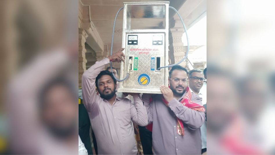 men holding silver petrol pump men holding silver petrol pump