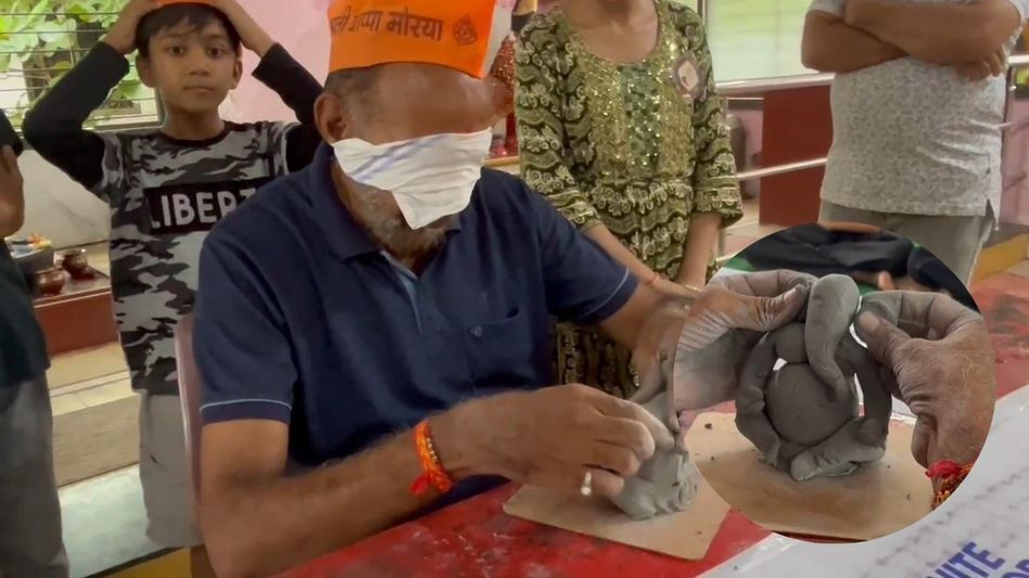 Akola artist making Ganesh idol with blindfold on eyes Akola artist making Ganesh idol with blindfold on eyes