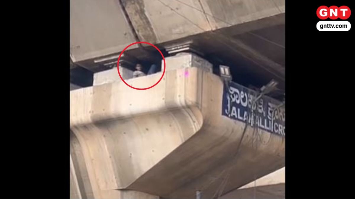 Man Under Flyover Source: @karnatakaportf