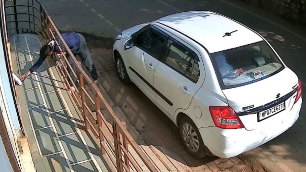 Young Man Stealing Newspaper
