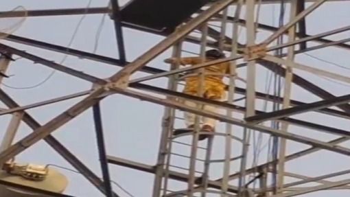 two friends climbed the closed mobile tower