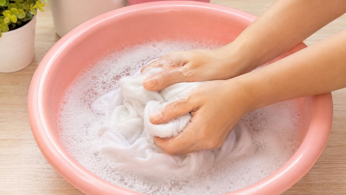 Hand-washing laundry in soapy water