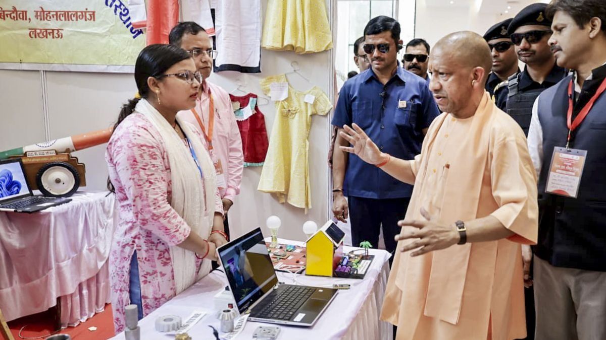 CM Yogi Adityanath with youths trained under ITIs (Photo/PTI)