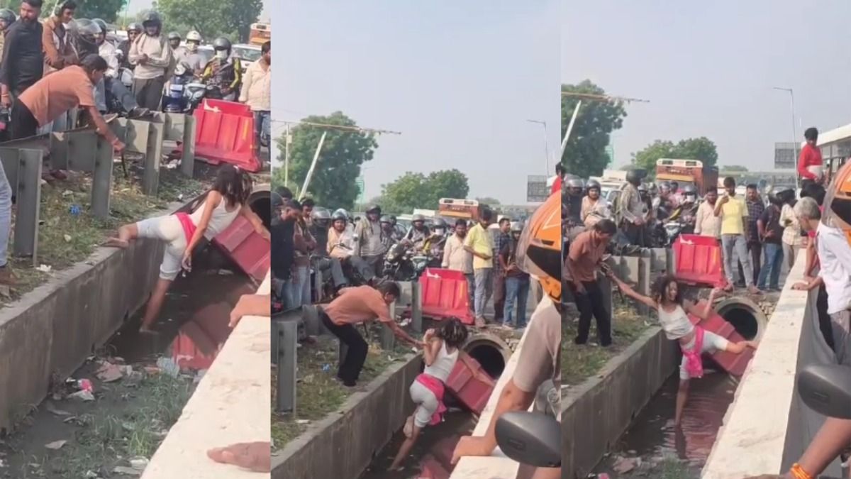 महिला को बचाने की कोशिश करते लोग