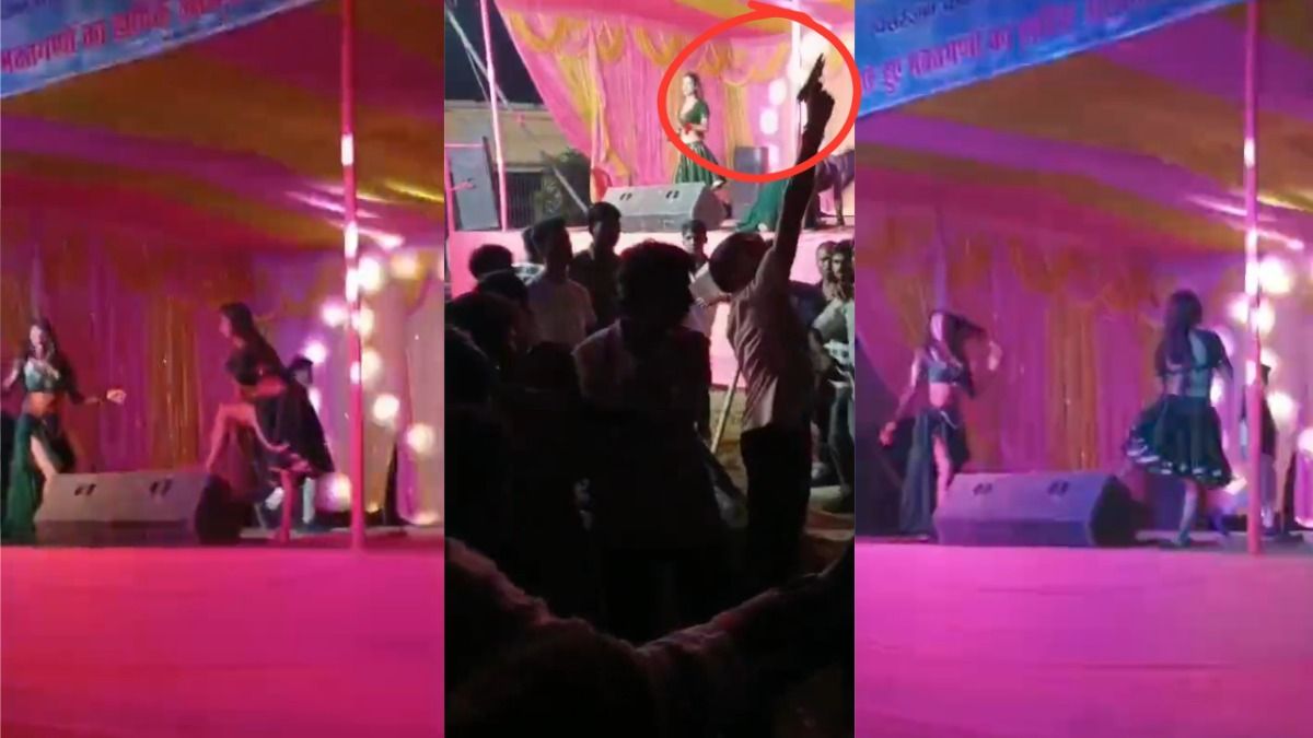 मंच के नीचे से हवाई फायरिंग करता युवक