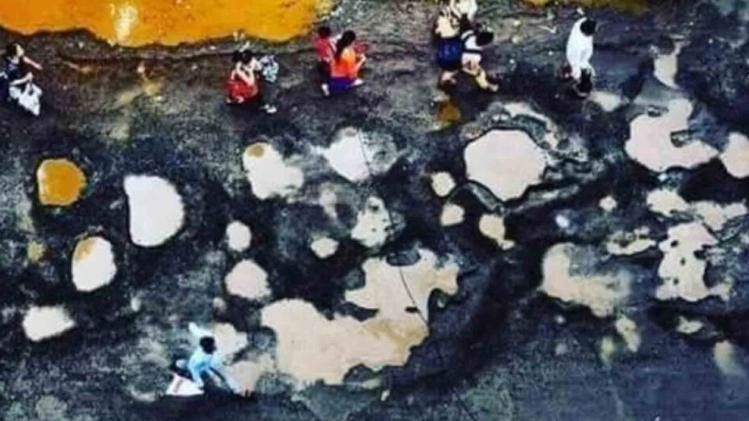 Road filled with potholes shared as Varanasi