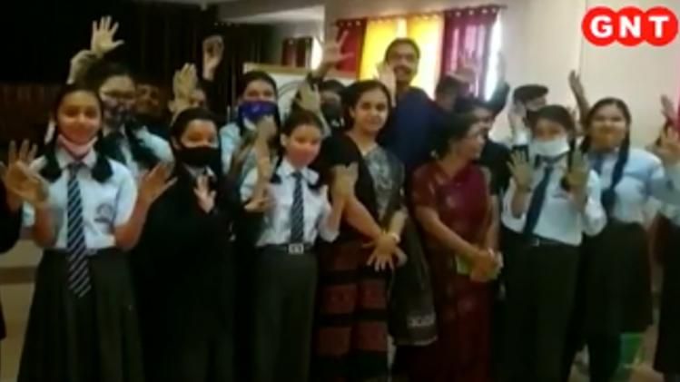 Children make diyas on chalk