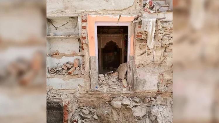 temple demolished by bulldozer