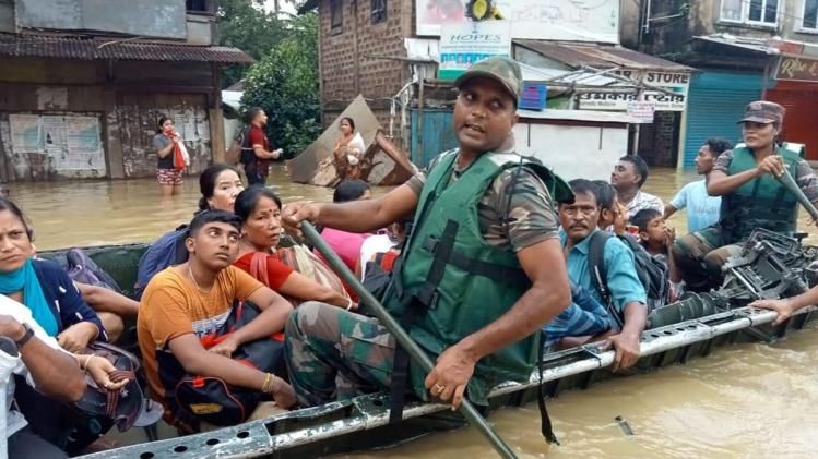 Security personnel rescue people from a flood-affected area in Silchar