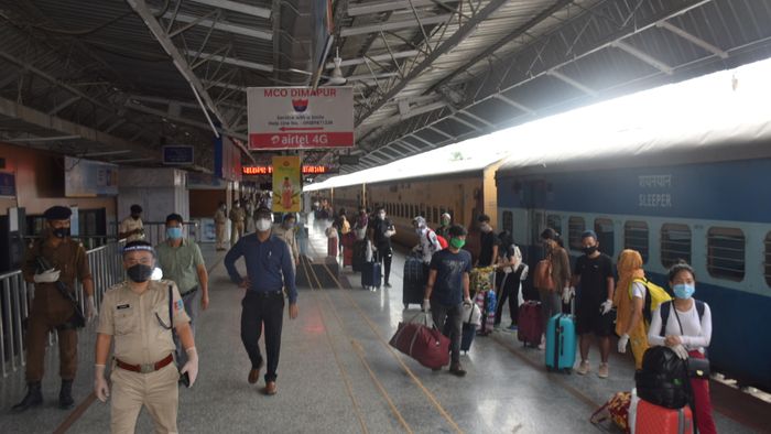 Returnees arrive in Dimapur railway station on Thursday.