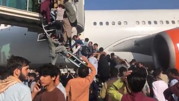 US troops fire shots into air at Kabul Airport