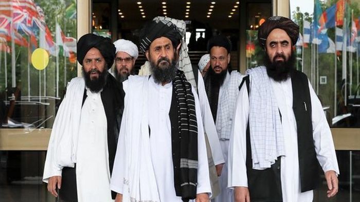Members of a Taliban delegation, led by chief negotiator Mullah Abdul Ghani Baradar (C, front), leave after peace talks with Afghan senior politicians in Moscow, Russia May 30, 2019. REUTERS/Evgenia Novozhenina