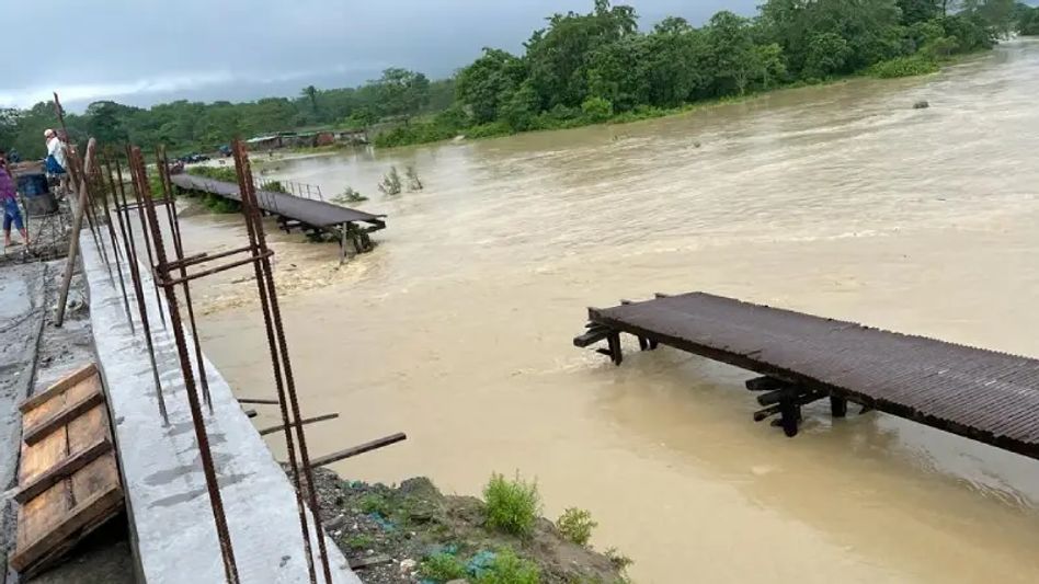 Assam Flood: Rising water grims Tamulpur district; sweeps iron bridge Assam Flood: Rising water grims Tamulpur district; sweeps iron bridge