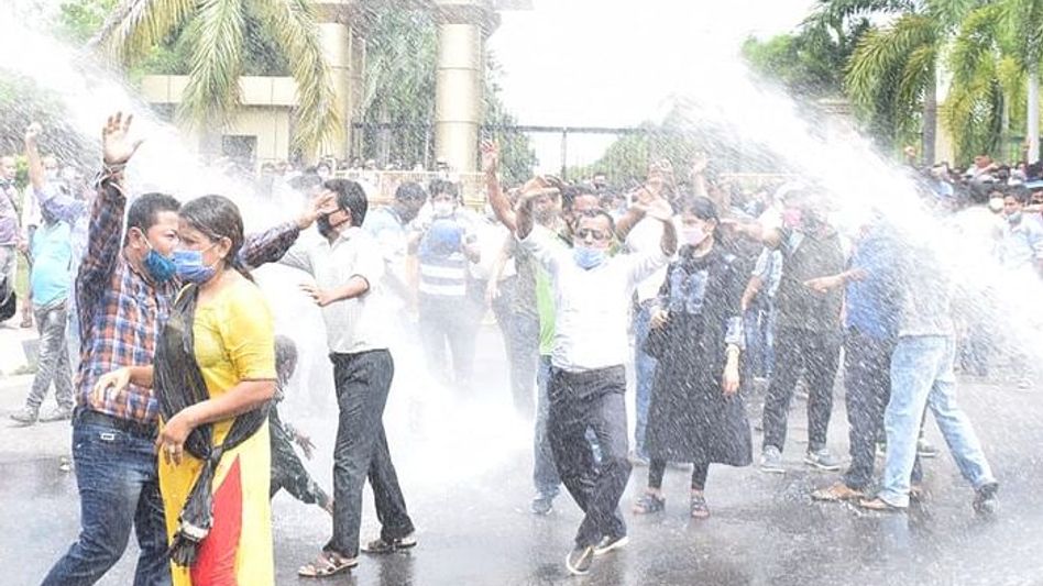 Tripura: Police fire tear gas shells, lathi-charge to disperse teachers protesting near CM's residence Tripura: Police fire tear gas shells, lathi-charge to disperse teachers protesting near CM's residence