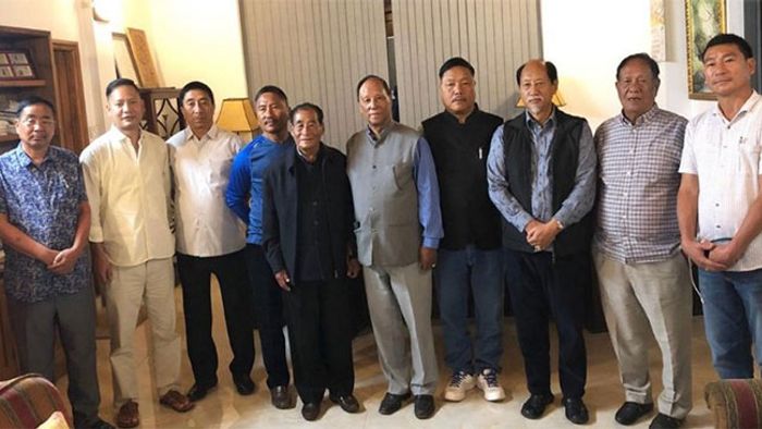 The seven opposition MLAs posing with Nagaland Chief Minister Neiphiu Rio