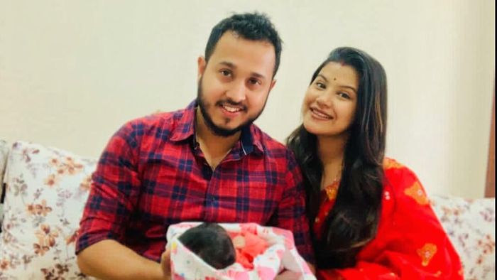 Actress Amrita Gogoi poses with her baby