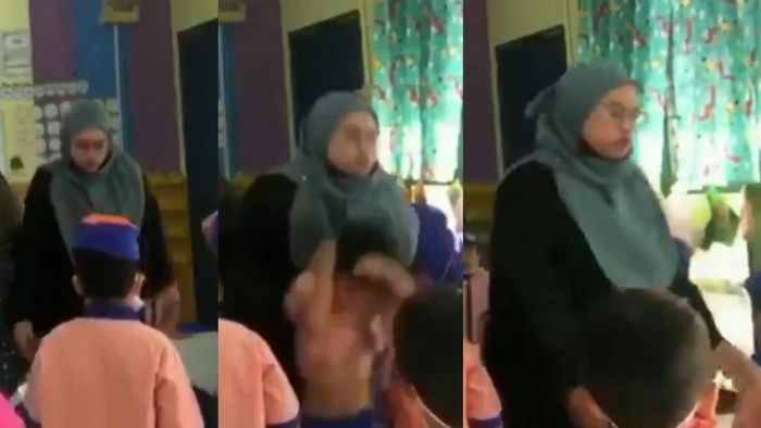 Teacher shoving a KG student in classroom