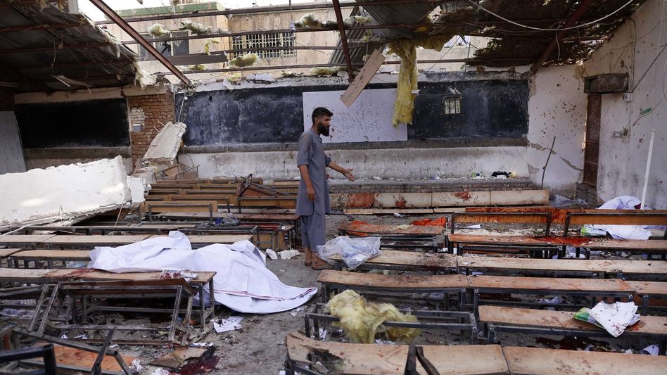 Death toll in Afghan school blast rises to 58, families bury corpses Death toll in Afghan school blast rises to 58, families bury corpses