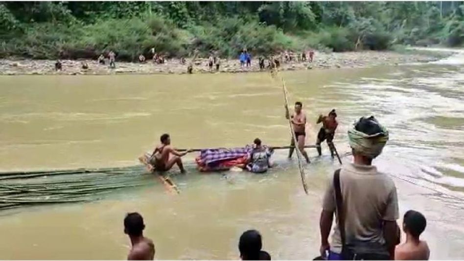 Manipur: Sick man ferried across a flooded Barak river, video goes viral  Manipur: Sick man ferried across a flooded Barak river, video goes viral