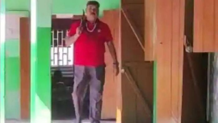 Teacher carrying machete