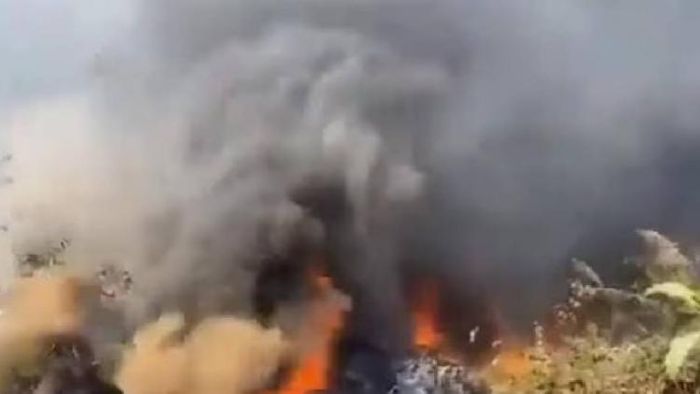 Smoke coming out of the plane that crashed on the runway of Pokhara International Airport