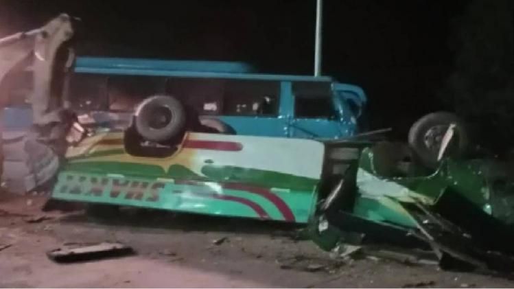 Mangled remains of bus after accident