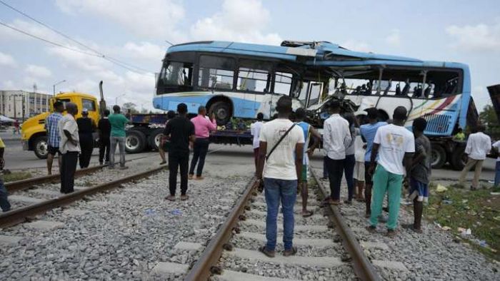 Six people were killed and dozens were injured in a collision between a train and a bus