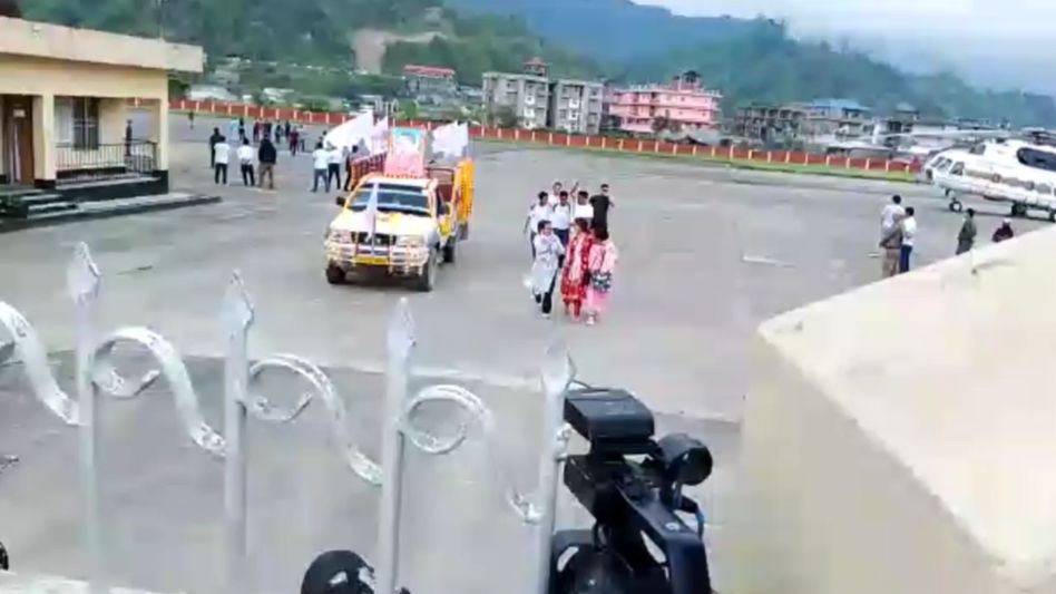 Arunachal: Mortal remains of whistleblower in APPSC paper leak scam Gyamar Padang reaches Naharlagun helipad Arunachal: Mortal remains of whistleblower in APPSC paper leak scam Gyamar Padang reaches Naharlagun helipad