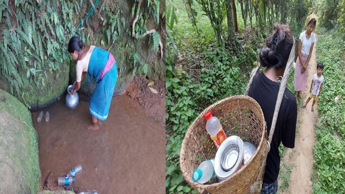 Villagers collecting water from a stream at the hillside
