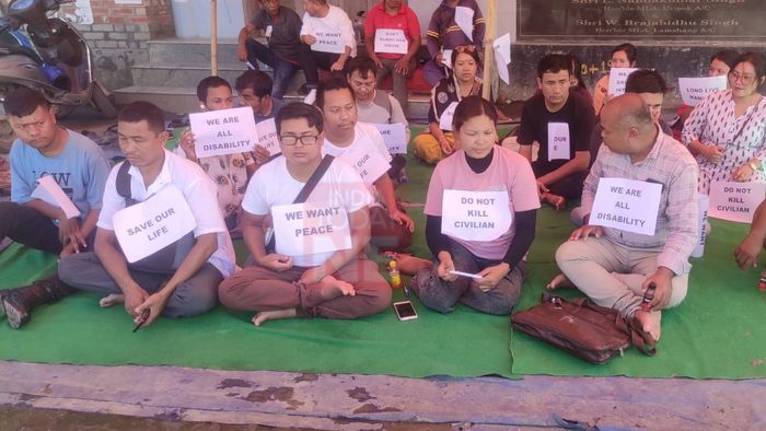 Differently abled person stages protest demanding peace and stability in Manipur