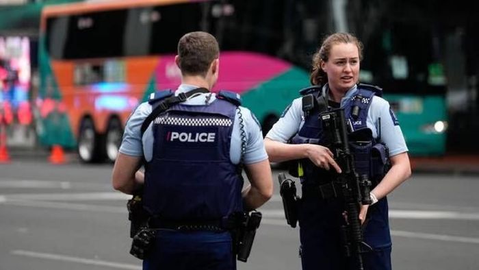 Armed New Zealand officer stand guarding ahead of FIFA World Cup match