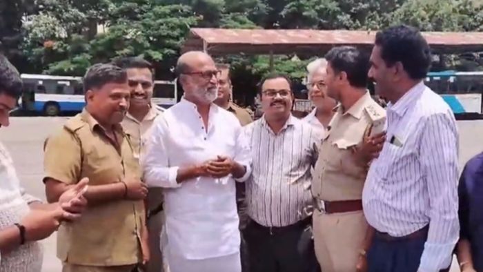 Actor Rajinikanth interacts with bus drivers and conductors at BMTC bus depot
