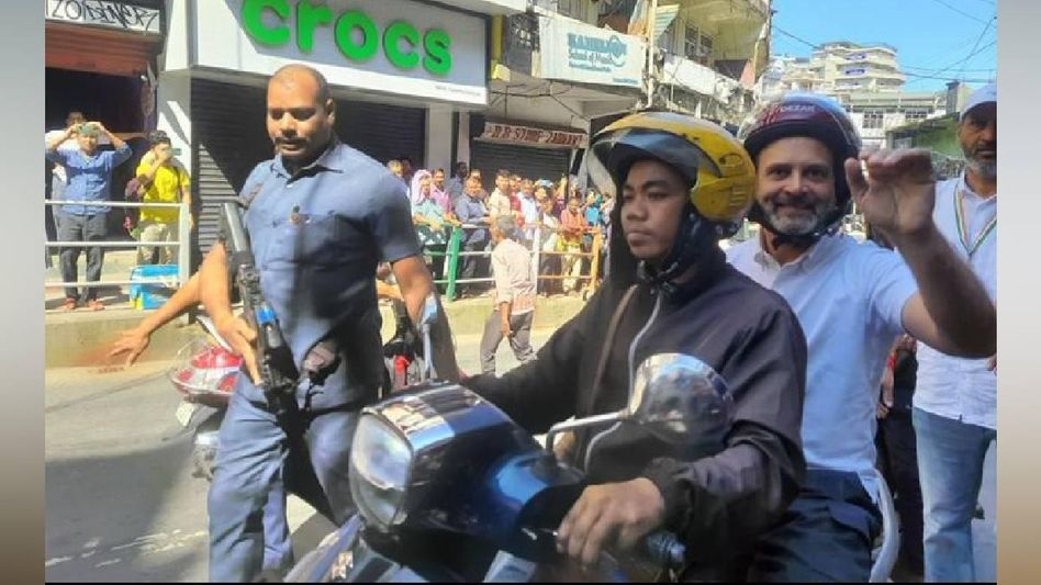 Congress MP Rahul Gandhi rides pillion on two-wheeler to reach the residence of former Mizoram CM Congress MP Rahul Gandhi rides pillion on two-wheeler to reach the residence of former Mizoram CM
