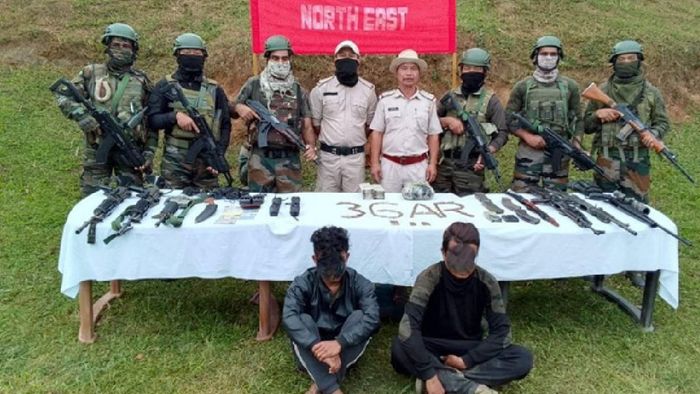 Arrested militants with seized items