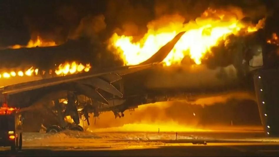 Japan's coast guard says 5 crewmembers missing after plane catches fire following collision Japan's coast guard says 5 crewmembers missing after plane catches fire following collision