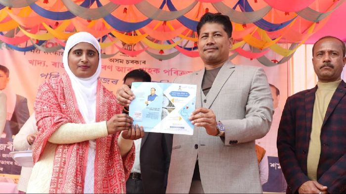 Assam Minister Pijush Hazarika distributes ration cards to 14,079 families at Laharighat ceremony