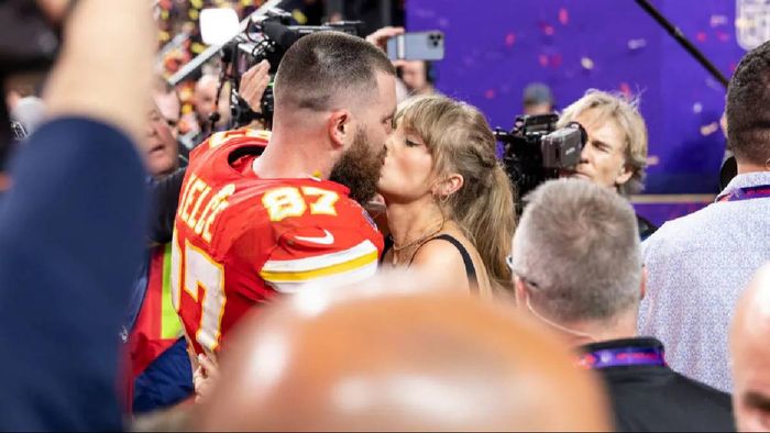 Travis Kelce, Kansas City Chiefs' tight end, dismisses conspiracy theories doubting his relationship with Taylor Swift.