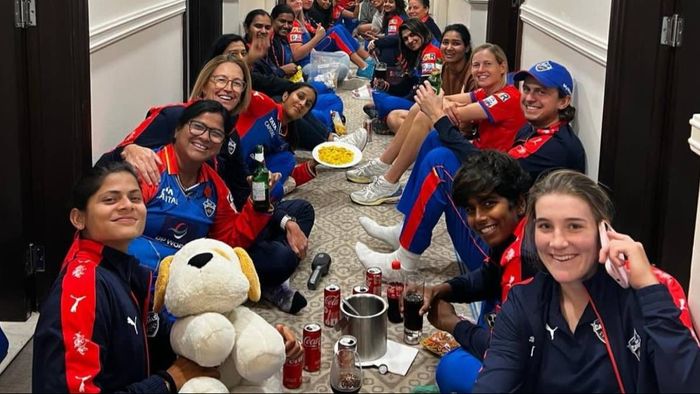 Delhi Capitals players sit on hotel floor with soda, ice box and munchies after WPL final defeat