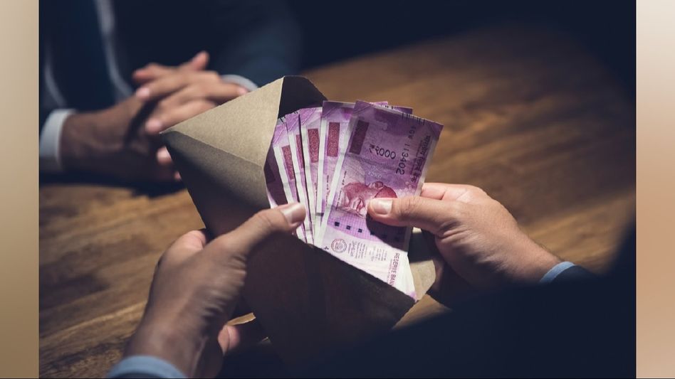 Assam: Power department employee caught red-handed while accepting bribe in Nagaon Assam: Power department employee caught red-handed while accepting bribe in Nagaon