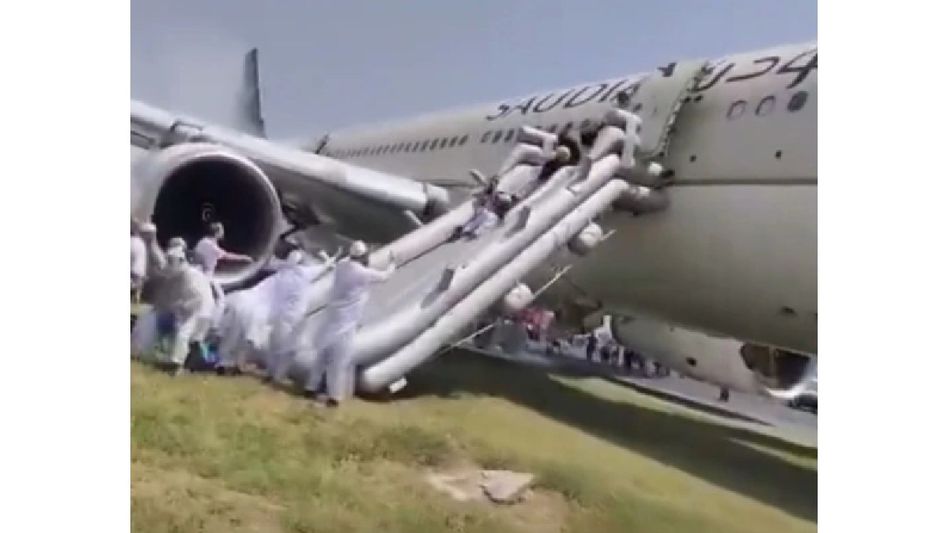 Saudi Airlines flight catches fire during landing in Peshawar, all 297 aboard safely evacuated Saudi Airlines flight catches fire during landing in Peshawar, all 297 aboard safely evacuated