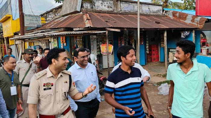 Dhalai District Magistrate Saju Vaheed and District SP Avinash Rai, in Gandatwisa Market, on Tuesday..